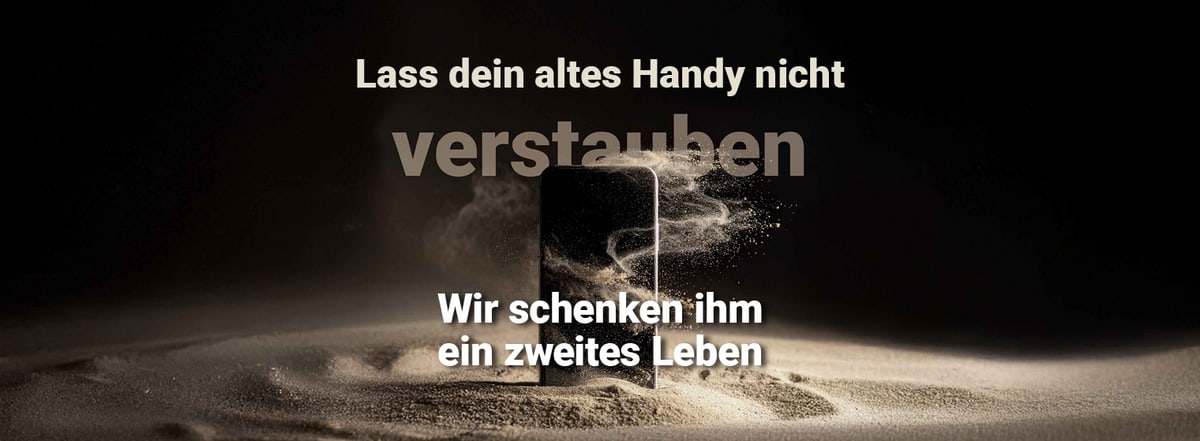 Handy in einer Sandlandschaft umkreist von Sand